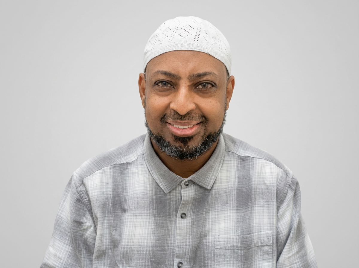 Professional portrait of Omar Dida FCCA, Founder of Galaxy Business Solutions (UK) Ltd, photographed from mid-chest upward against a light background